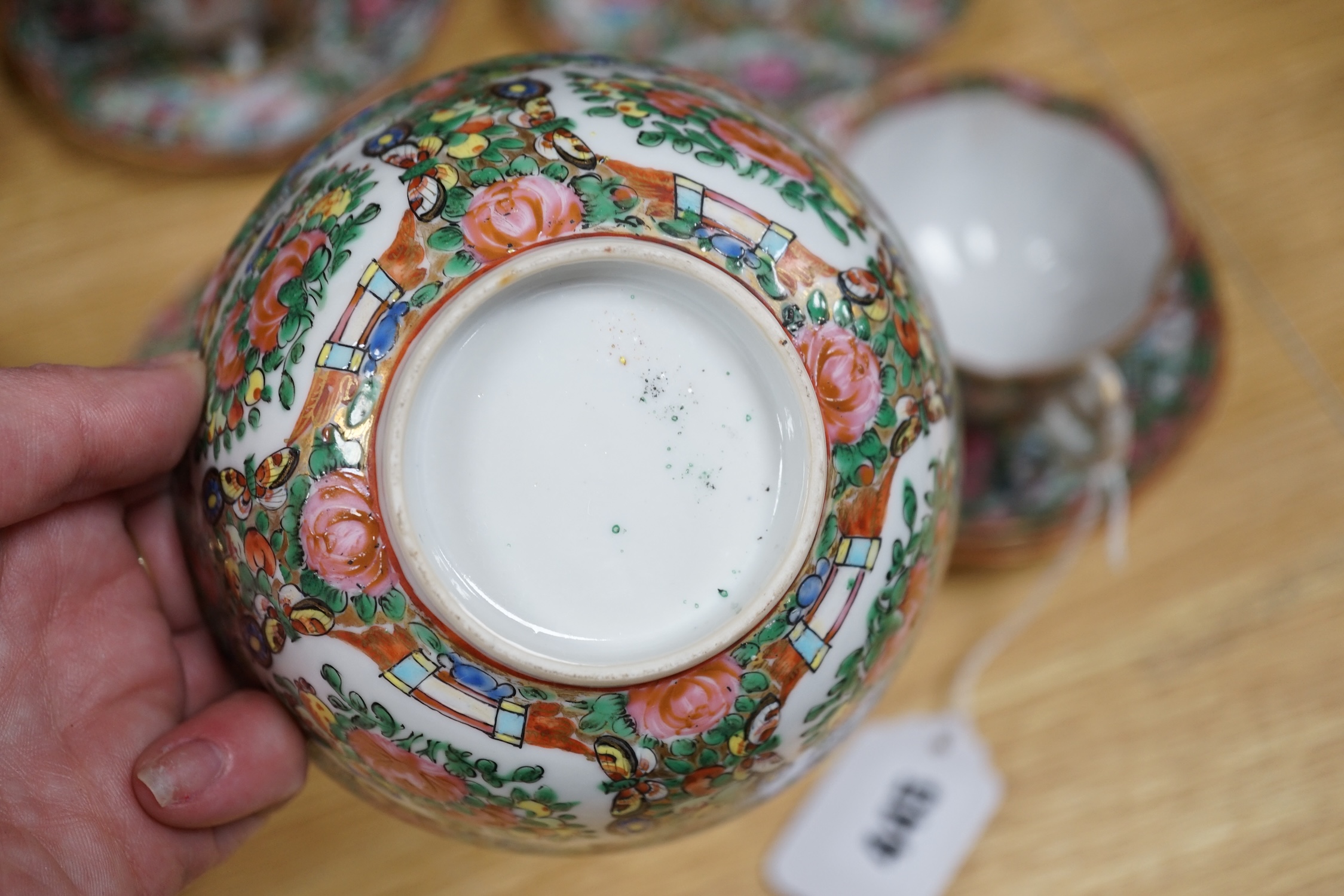A Chinese famille rose part tea set including: five cups saucers and side plates, a teapot and cover, sugar bowl and cover, a cream jug, four cake plates and two square plates (27)